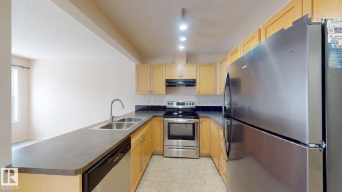 116 230 Edwards Drive, Edmonton, AB - Indoor Photo Showing Kitchen With Double Sink