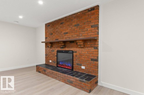 3043 142 Avenue, Edmonton, AB - Indoor Photo Showing Living Room With Fireplace