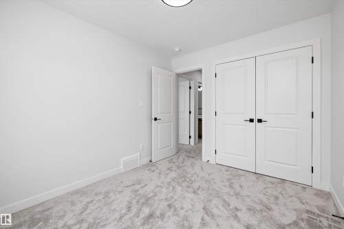 Unfurnished bedroom with carpet and a closet - 230 Edgemont Green Green Nw, Edmonton, AB - Indoor Photo Showing Other Room