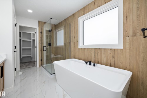 Bathroom with a shower stall, healthy amount of natural light, vanity, a walk in closet, and recessed lighting - 230 Edgemont Green Green Nw, Edmonton, AB - Indoor Photo Showing Bathroom