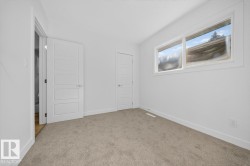 Unfurnished bedroom featuring baseboards and carpet floors - 