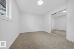 Unfurnished bedroom featuring a closet and light colored carpet - 