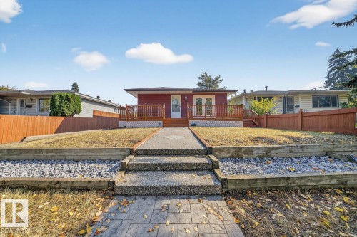 Ranch-style home featuring a wooden deck - 12919 113A Street, Edmonton, AB - Outdoor