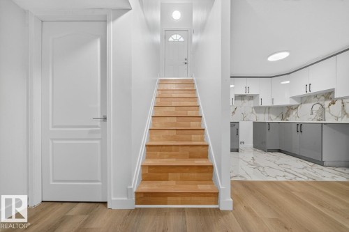 Stairs featuring wood finished floors - 12919 113A Street, Edmonton, AB - Indoor