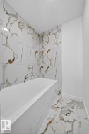 Bathroom with marble finish floors and baseboards - 