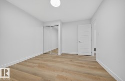 Unfurnished bedroom featuring light wood finished floors and a closet - 