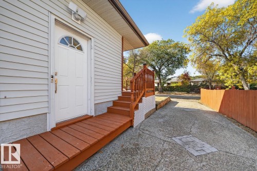 Doorway to property featuring a wooden deck - 12919 113A Street, Edmonton, AB - Outdoor With Exterior