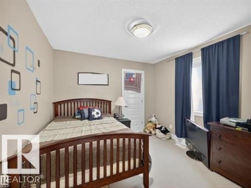 Bedroom with light colored carpet - 520 Stewart Crescent, Edmonton, AB - Indoor Photo Showing Bedroom