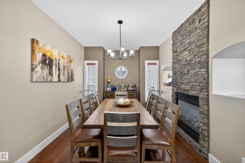 520 Stewart Crescent, Edmonton, AB - Indoor Photo Showing Dining Room With Fireplace