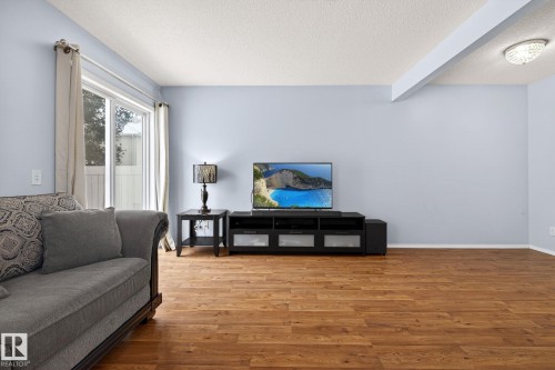 108 150 Edwards Drive, Edmonton, AB - Indoor Photo Showing Living Room