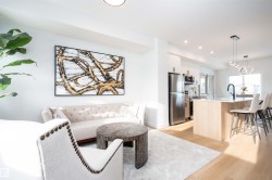 Living area featuring light wood-style flooring and recessed lighting - 