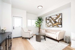 Living room featuring light wood-style floors - 