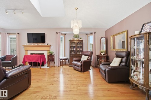 8 9731 174 Street, Edmonton, AB - Indoor Photo Showing Living Room With Fireplace