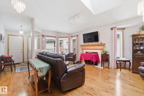 8 9731 174 Street, Edmonton, AB - Indoor Photo Showing Living Room With Fireplace