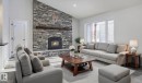 311 55504 Rr 13, Rural Lac Ste. Anne County, AB  - Indoor Photo Showing Living Room With Fireplace 