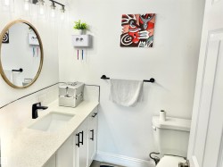 Half bath with vanity and decorative backsplash - 