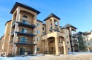 Snow covered property with a view of apartment building / complex - 205 14604 125 Street, Edmonton, AB  - Outdoor With Facade 