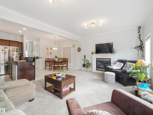 10941/10943 76 Avenue, Edmonton, AB - Indoor Photo Showing Living Room With Fireplace