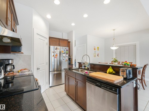 10941/10943 76 Avenue, Edmonton, AB - Indoor Photo Showing Kitchen With Double Sink