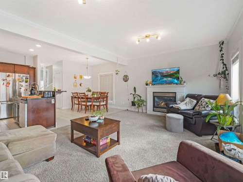 10941/10943 76 Avenue, Edmonton, AB - Indoor Photo Showing Living Room With Fireplace