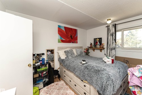 Bedroom with a textured ceiling - 2349 Millbourne Road W, Edmonton, AB - Indoor Photo Showing Bedroom