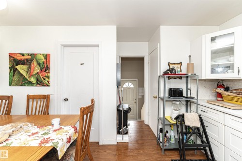 Dining room featuring dark wood-style flooring and baseboards - 2349 Millbourne Road W, Edmonton, AB - Indoor Photo Showing Dining Room