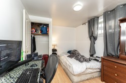 Bedroom featuring light wood-style flooring and a closet - 