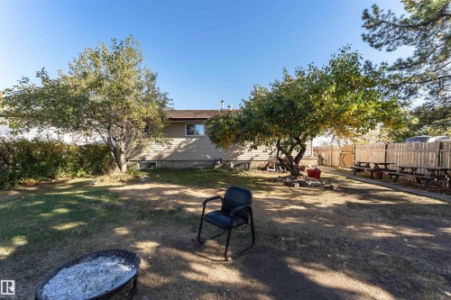 Fenced yard with a patio and an outdoor fire pit - 2349 Millbourne Road W, Edmonton, AB - Outdoor