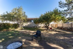Fenced yard with a patio and an outdoor fire pit - 