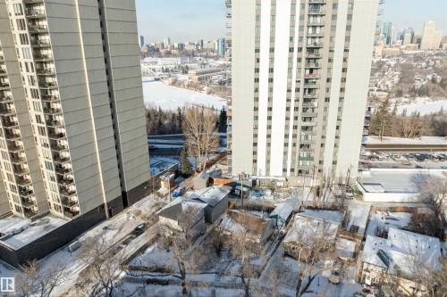 Snow covered building with a view of city - 10124 88 Avenue, Edmonton, AB - Outdoor With Facade
