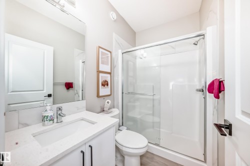Bathroom with a stall shower, vanity, and light wood-style floors - 4930 Hawthorn Place, Edmonton, AB - Indoor Photo Showing Bathroom