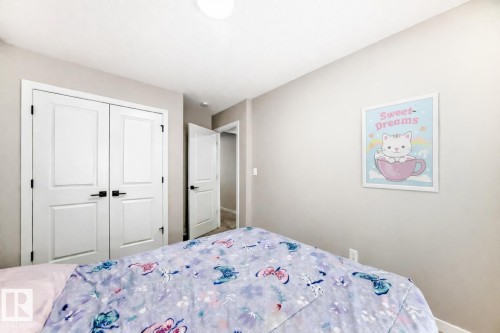 Bedroom with a closet and baseboards - 4930 Hawthorn Place, Edmonton, AB - Indoor Photo Showing Bedroom