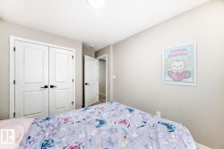 Bedroom with a closet and baseboards - 