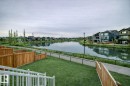 Fenced backyard featuring a residential view and a water view - 4930 Hawthorn Place, Edmonton, AB  - Outdoor With Body Of Water 