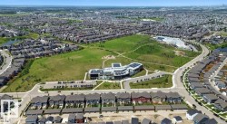 Aerial view of property and surrounding area with nearby suburban area - 