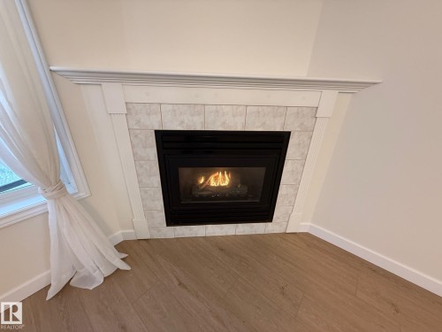 422 6703 172 Street, Edmonton, AB - Indoor Photo Showing Living Room With Fireplace