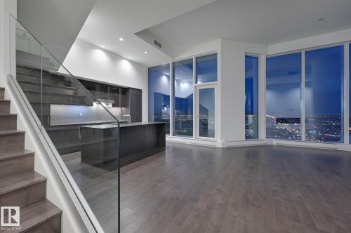 Stairs featuring wood finished floors and recessed lighting - 2303 10360 102 Street, Edmonton, AB - Indoor Photo Showing Other Room