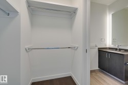 Bathroom with vanity and light wood-type flooring - 