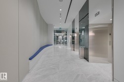 Hall with recessed lighting and light marble finish flooring - 