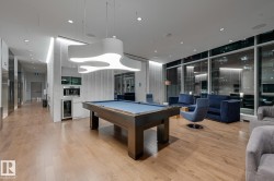 Rec room with pool table, beverage cooler, expansive windows, and recessed lighting - 