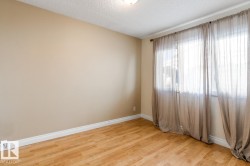 Unfurnished room featuring light wood-style flooring and a textured ceiling - 