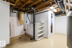 Unfinished basement featuring washer / dryer - 