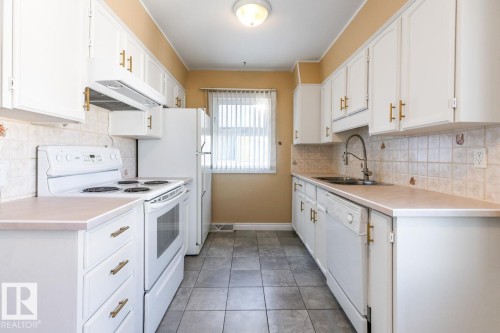 7324 77 Street, Edmonton, AB - Indoor Photo Showing Kitchen With Double Sink
