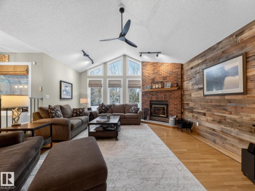 230 51350 Rge Rd 224, Rural Strathcona County, AB - Indoor Photo Showing Living Room With Fireplace