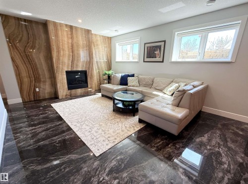 52025 Rge Road 272, Rural Parkland County, AB - Indoor Photo Showing Living Room With Fireplace