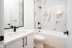 Full bath featuring vanity and shower / tub combination - 