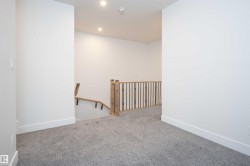 Carpeted empty room featuring baseboards and recessed lighting - 