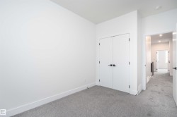 Unfurnished bedroom featuring carpet flooring and a closet - 