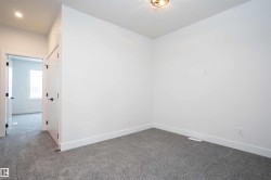 Empty room with baseboards and carpet - 