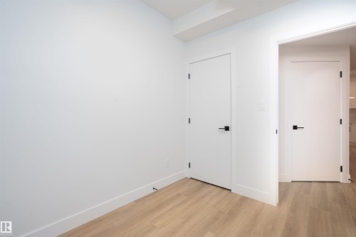 Washroom with light wood-type flooring - 430 Crystal Creek Link, Leduc, AB - Indoor Photo Showing Other Room